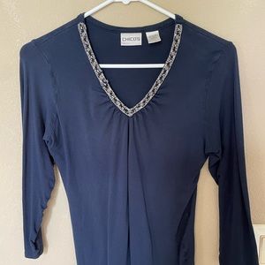 Quarter sleeve shirt with jewelry neckline